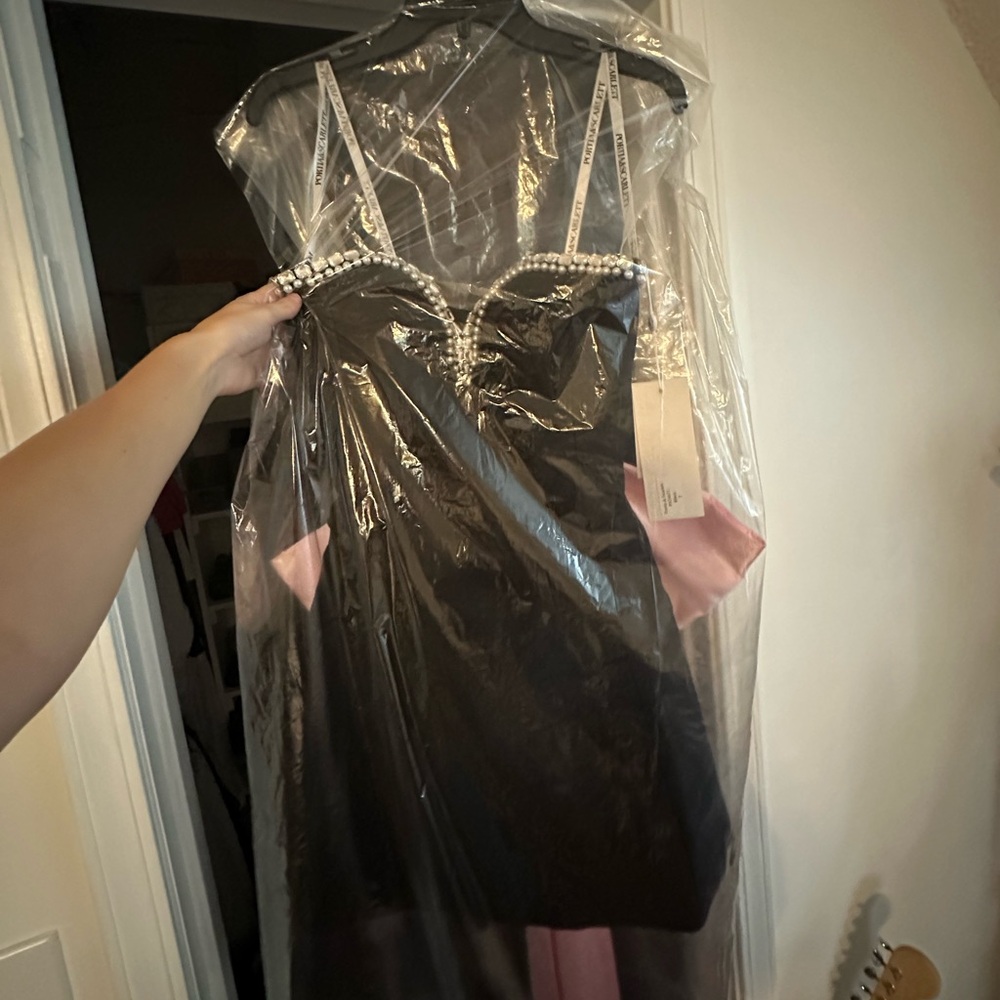 Dress is never worn with tags still on, selling it because it was too big on me.